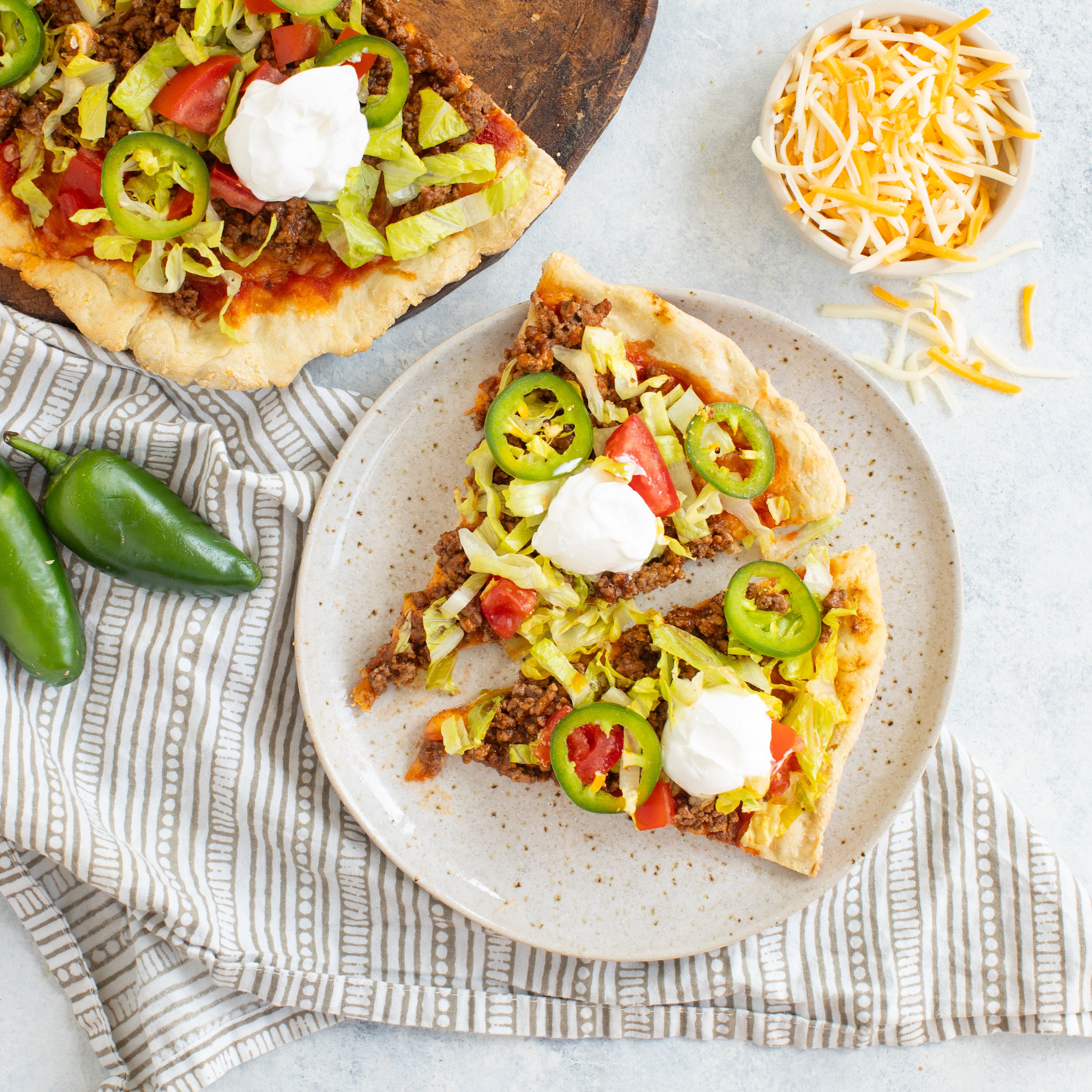 Lucerne Spicy "Taco" Cheese Pizza with Ground Beef, Lettuce, Tomato & Sour Cream
