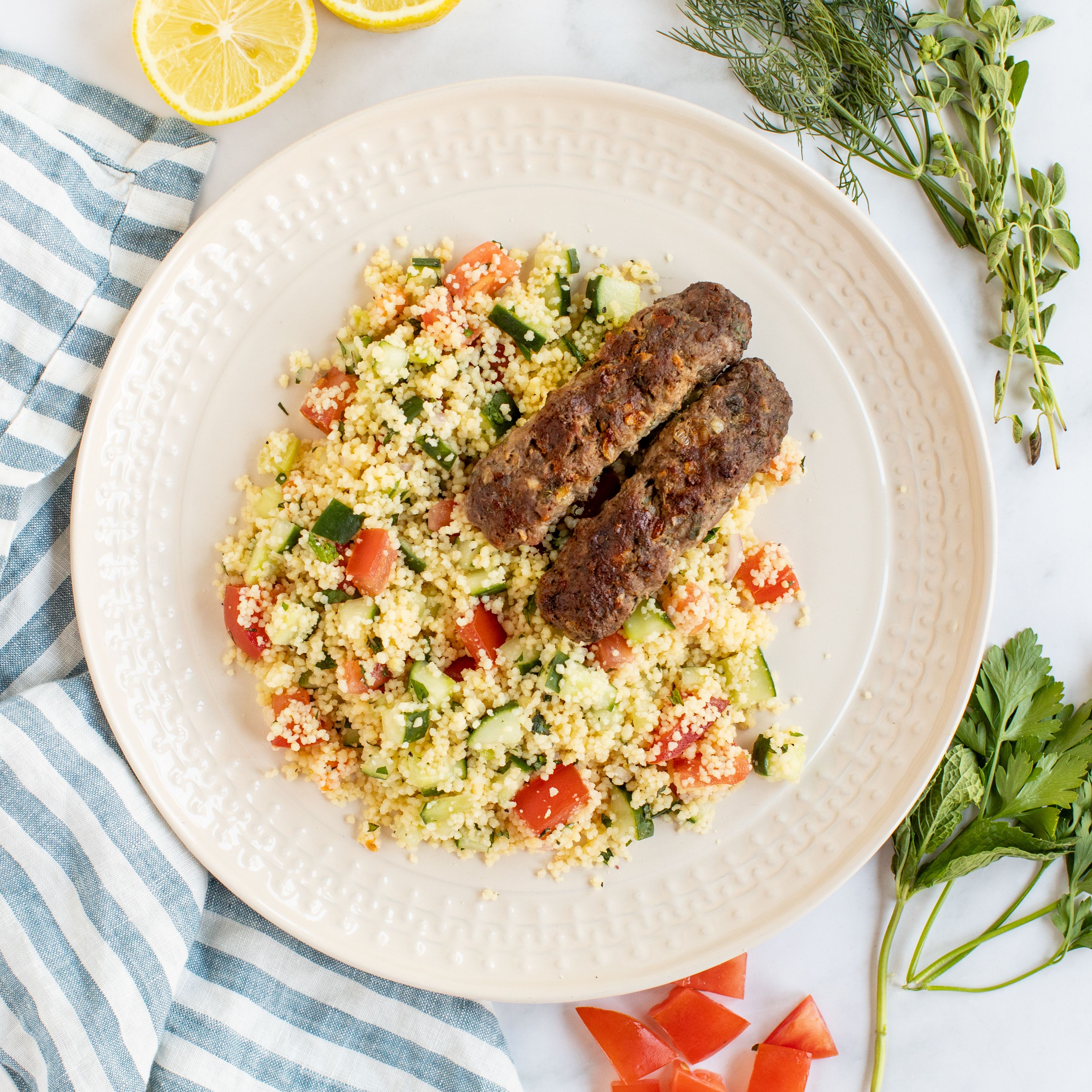 Mediterranean Herbed Lamb Kofta with Couscous, Cucumber & Tomato Salad