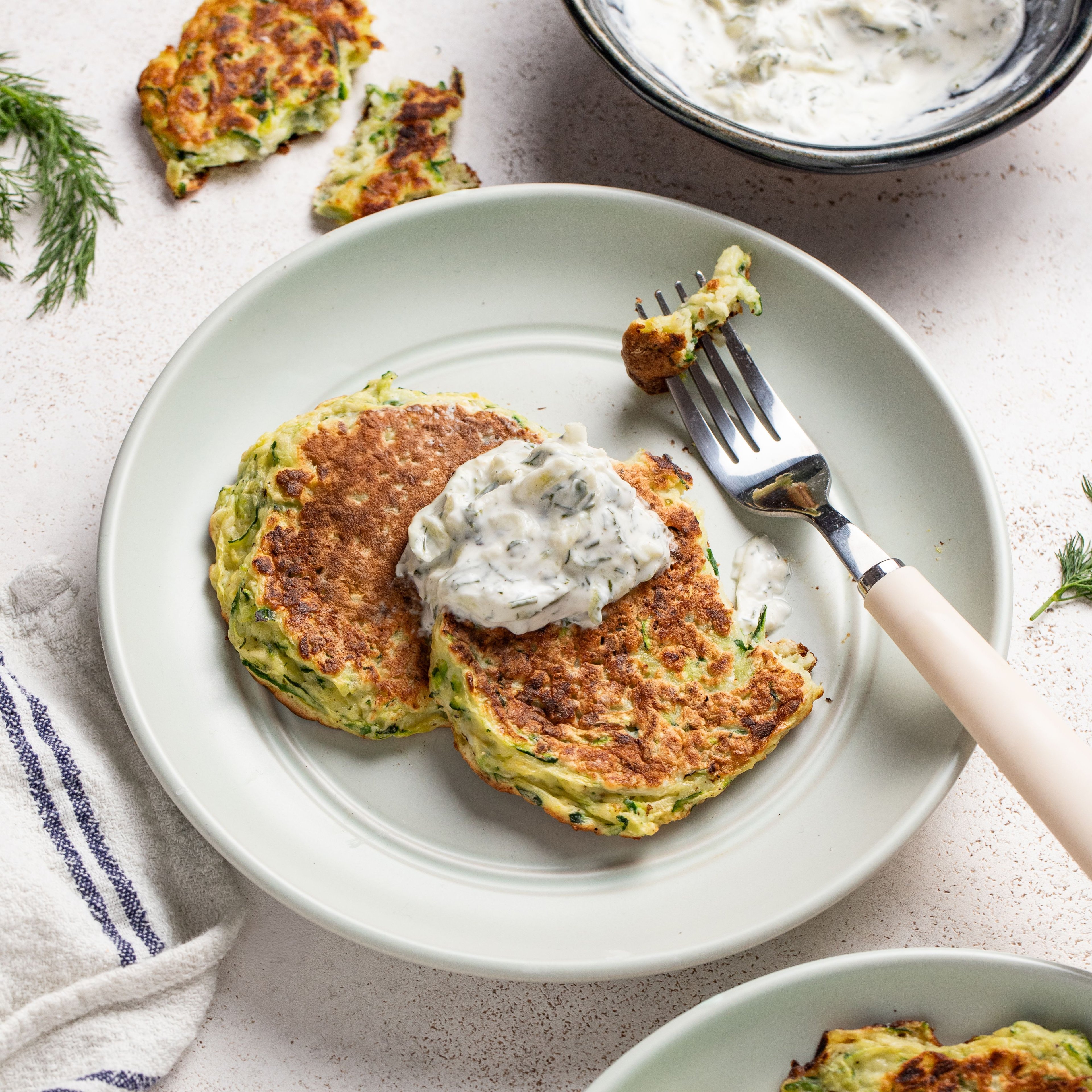 Pan-Fried Zucchini Fritters with Creamy Cucumber Tzatziki Sauce