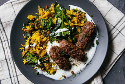 Beef Kofta over Turmeric Rice with Spinach, Pine Nuts, and Currants