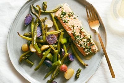 Salmon en Papillote with Spring Vegetables and GarlicHerb Butter