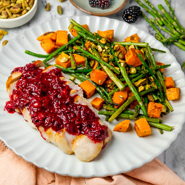 Pork Chop with Blackberry Sauce, Sweet Potato, Asparagus & Pistachios