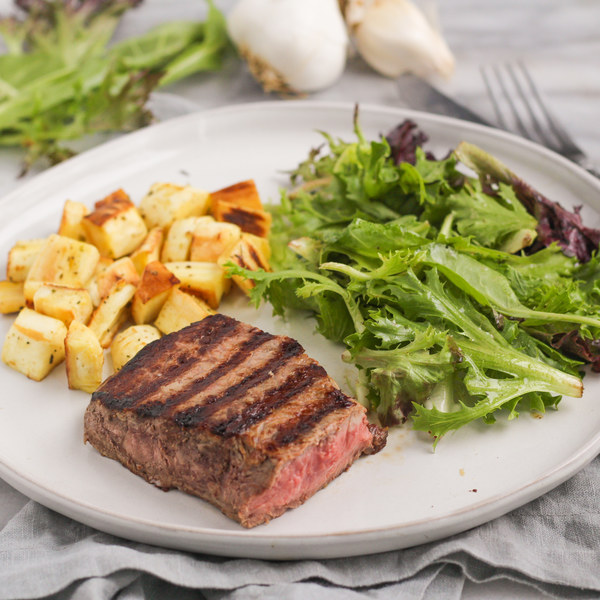 Grilled Ribeye Steak with Roasted Parsnips & Dijon Greens