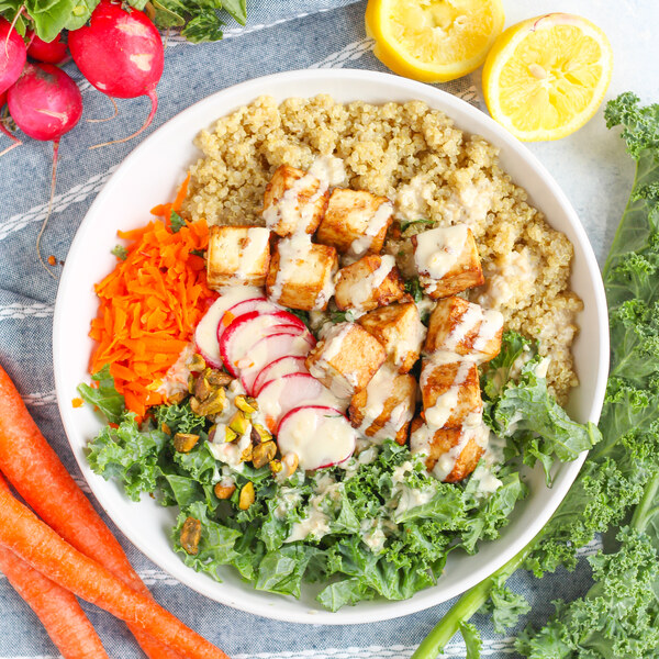 Crispy Tofu Quinoa Bowl with Kale, Pickled Radish & Lemon-Tahini Sauce