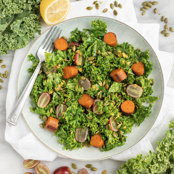 Kale Salad with Vegan Sausage, Grapes & Pumpkin Seeds