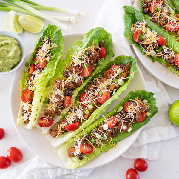 Veggie Ground Taco Salad Boats with Beans, Tomato, Cheese & Guacamole