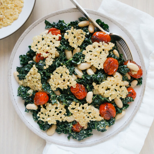 Kale Caesar Salad with White Beans, Charred Tomatoes & Parmesan Crisps