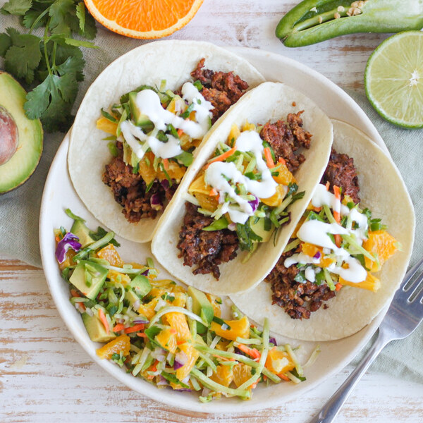 Veggie Ground Tacos with Orange-Avocado Slaw, Cilantro & Lime Crema