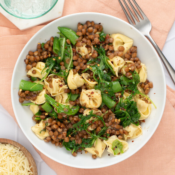 Spicy Tortellini with Lentils, Snap Peas, Wilted Arugula & Parmesan
