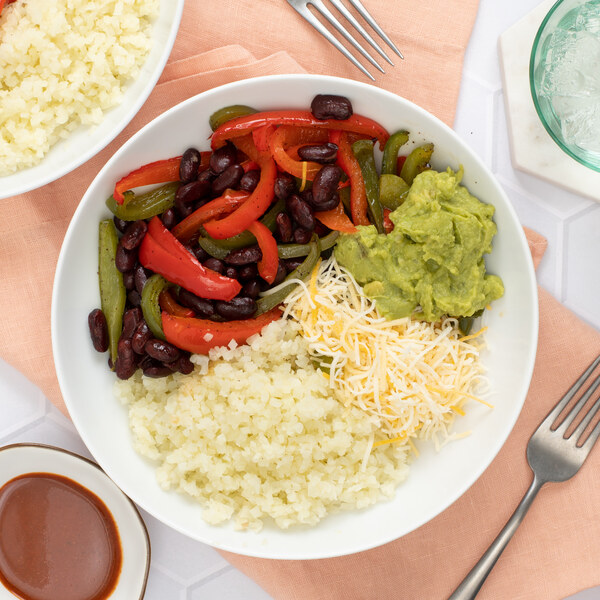 Cauliflower Rice Burrito Bowl with Beans, Peppers, Guacamole & Cheese
