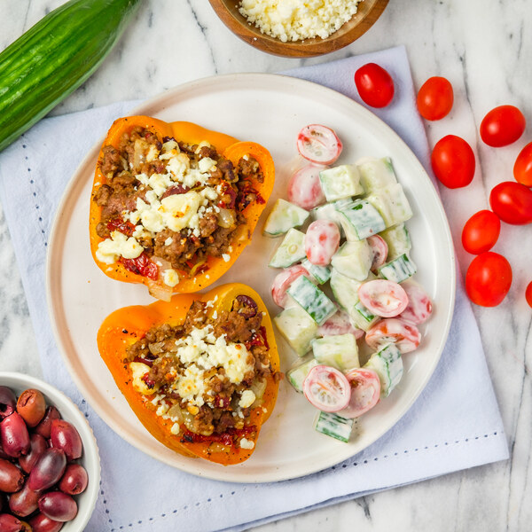 Veggie Ground, Olive & Feta-Stuffed Peppers with Cucumber-Tomato Salad