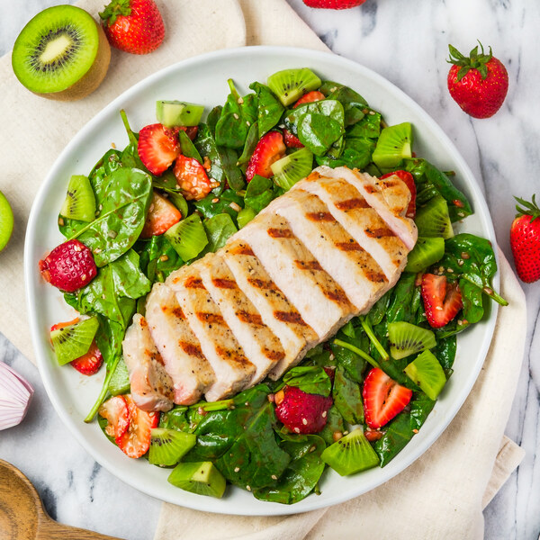 Grilled Pork Chop over Strawberry-Kiwi Spinach Salad
