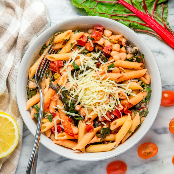 White Bean Penne with Swiss Chard, Tomato, Parmesan, Mint & Pistachios