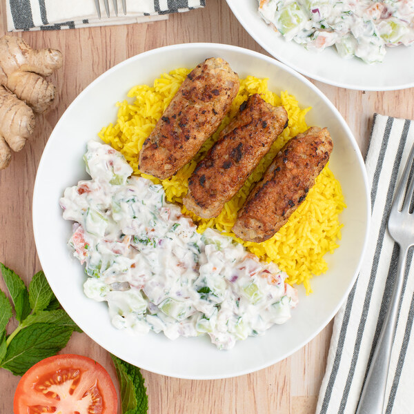 Chicken Kofta over Turmeric Rice with Cucumber, Tomato & Mint Raita