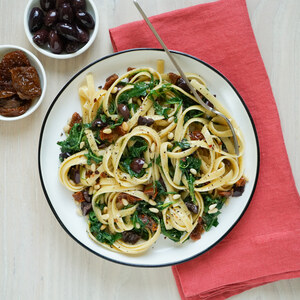 Sun-Dried Tomato Fettuccine with Olives, Pine Nuts, Arugula & Parmesan
