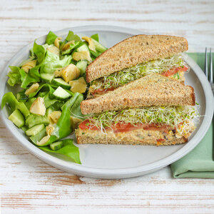 Mediterranean Chickpea Sandwich with Sprouts, Tomato & Side Salad