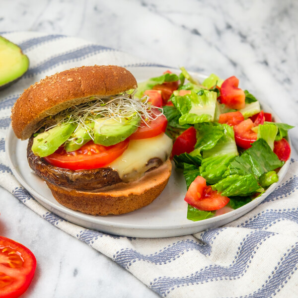 Cheesy Portobello "Smash" Burger with Avocado, Sprouts & Romaine Salad
